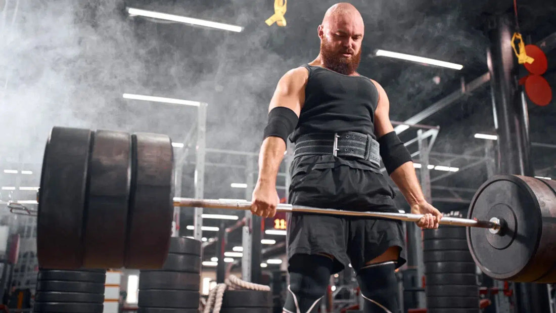 Man lifting bumper plates