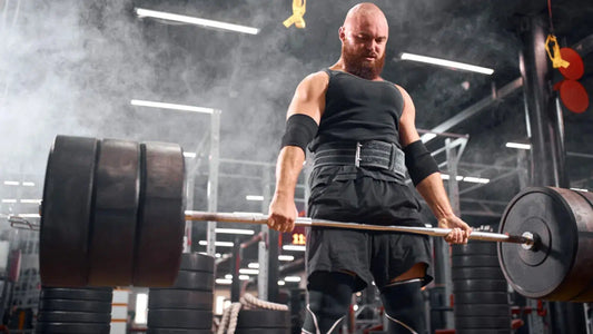 Man lifting bumper plates