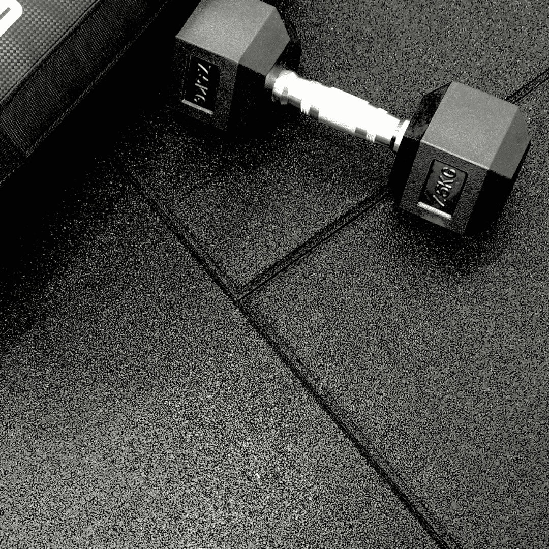 close upof 20mm gym mats with dumbbell