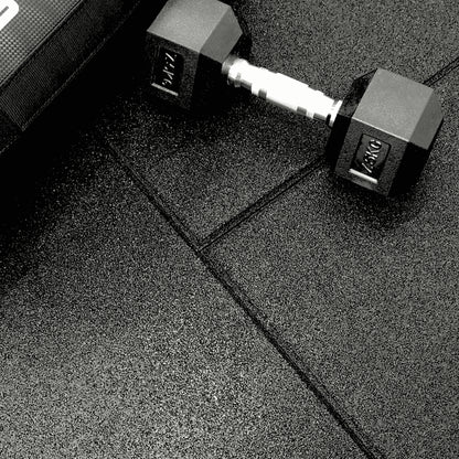 close upof 20mm gym mats with dumbbell